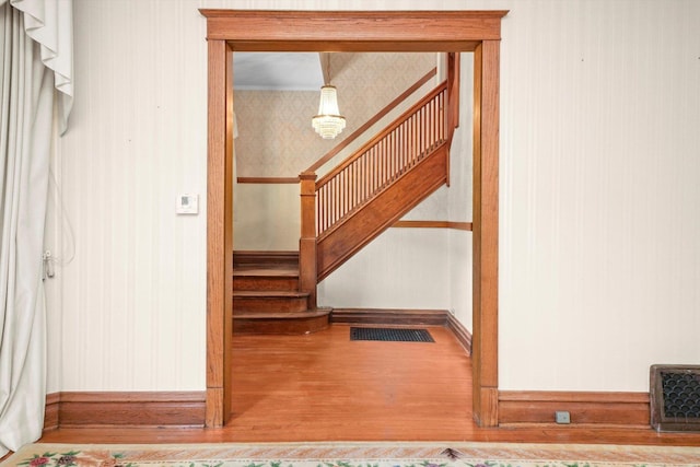 31 Bluff Ave, La Grange, IL 60525 - staircase with wallpapered walls and wood finished floors
