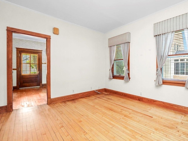 31 Bluff Ave, La Grange, IL 60525 - empty room featuring light wood-type flooring, plenty of natural light, and crown molding