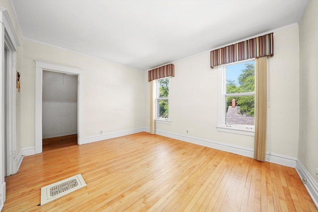 31 Bluff Ave, La Grange, IL 60525 - empty room with light wood-style flooring and ornamental molding
