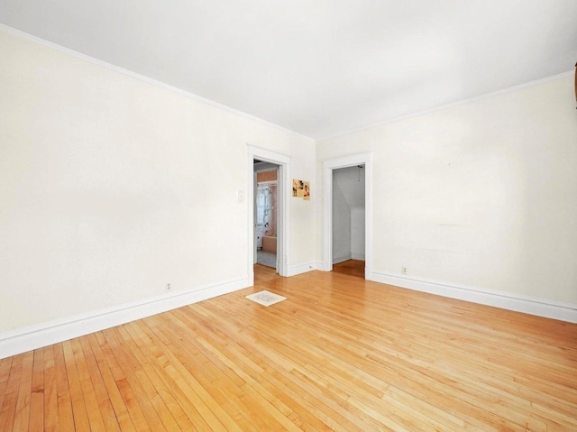 31 Bluff Ave, La Grange, IL 60525 - empty room with light wood-style floors and crown molding