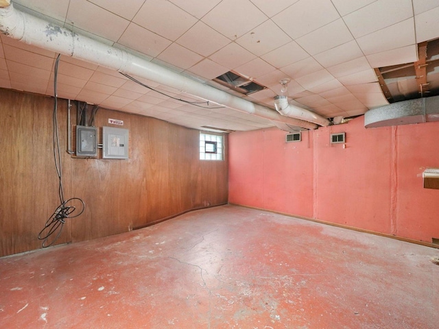 31 Bluff Ave, La Grange, IL 60525 - below grade area with electric panel, a drop ceiling, and wood walls