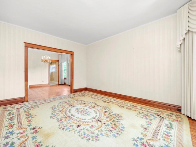 31 Bluff Ave, La Grange, IL 60525 - unfurnished room featuring wood finished floors, a chandelier, and ornamental molding