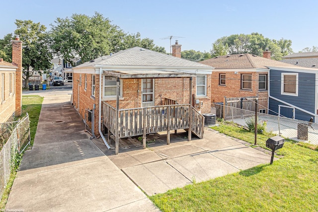 3855 W 107th St, Chicago, IL 60655 - rear view of house with a wooden deck, brick siding, and a chimney