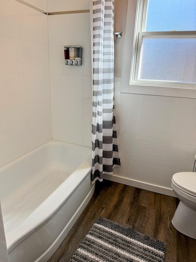 9003 Bronx Ave, Skokie, IL 60077 - bathroom with wood finished floors and shower / bath combo with shower curtain