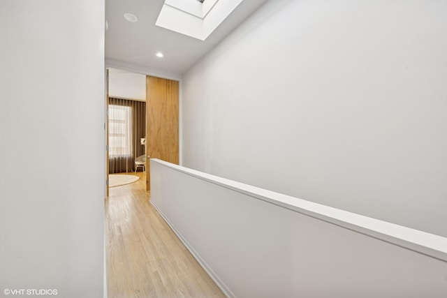 65 W Schiller St, Chicago, IL 60610 - hallway featuring a skylight, light wood-type flooring, and recessed lighting