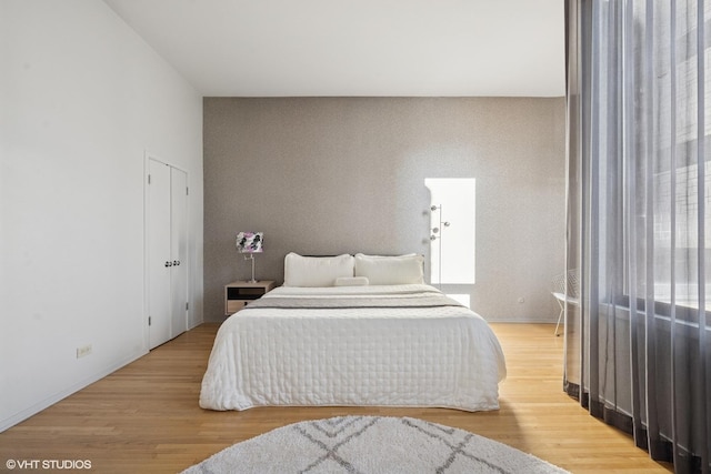 65 W Schiller St, Chicago, IL 60610 - bedroom featuring light wood-style floors and baseboards