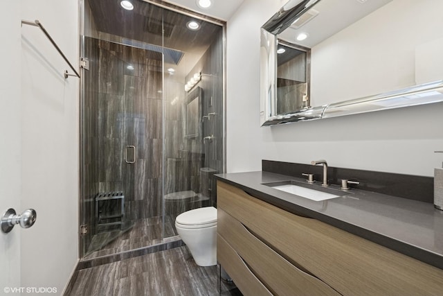 65 W Schiller St, Chicago, IL 60610 - bathroom with heating unit, a shower stall, vanity, and recessed lighting