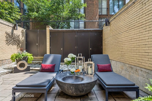 65 W Schiller St, Chicago, IL 60610 - view of patio with an outdoor fire pit
