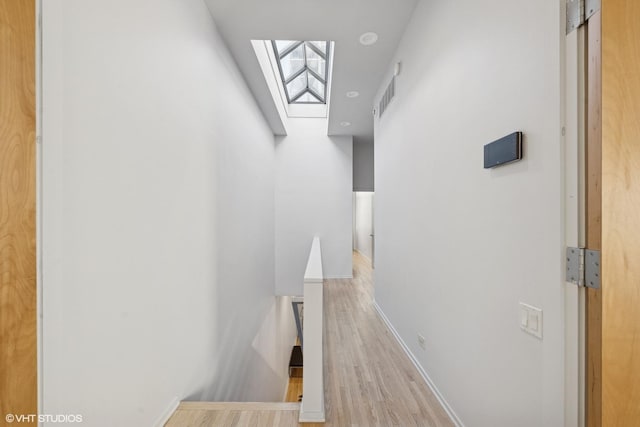 65 W Schiller St, Chicago, IL 60610 - staircase featuring a skylight and wood finished floors