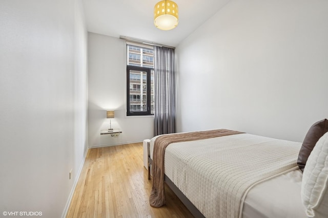 65 W Schiller St, Chicago, IL 60610 - bedroom featuring light wood finished floors and baseboards