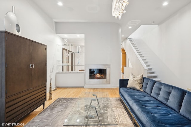 65 W Schiller St, Chicago, IL 60610 - living room featuring stairway, wood finished floors, recessed lighting, and a glass covered fireplace