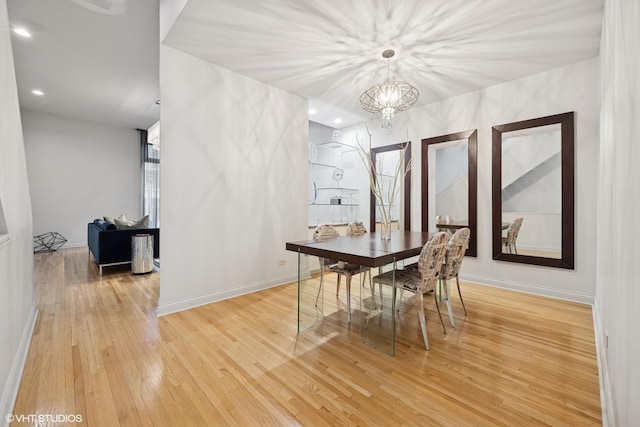 65 W Schiller St, Chicago, IL 60610 - dining space featuring light wood finished floors, a chandelier, and recessed lighting