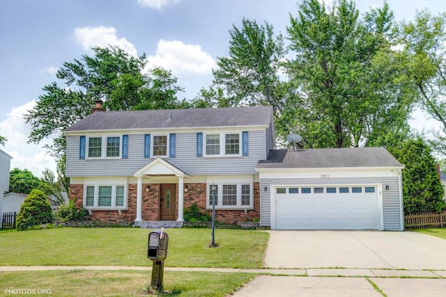 950 Belmar Ln, Buffalo Grove, IL 60089 - colonial inspired home with driveway, an attached garage, brick siding, and a chimney