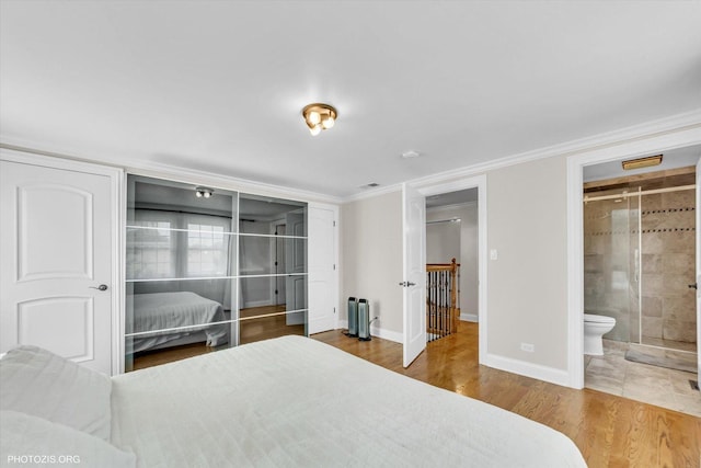 950 Belmar Ln, Buffalo Grove, IL 60089 - bedroom with ornamental molding, wood finished floors, and ensuite bath
