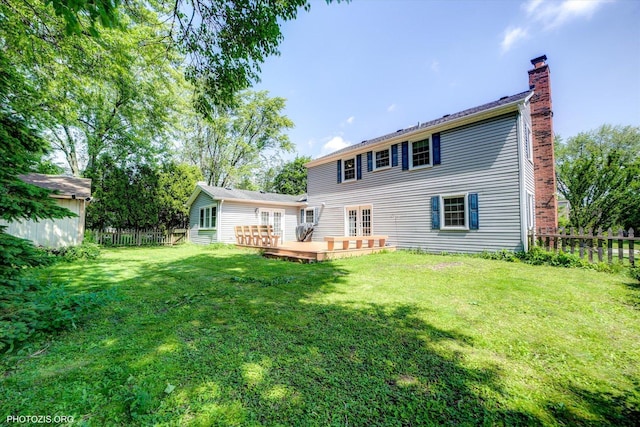950 Belmar Ln, Buffalo Grove, IL 60089 - back of house with a chimney, a fenced backyard, a deck, and french doors