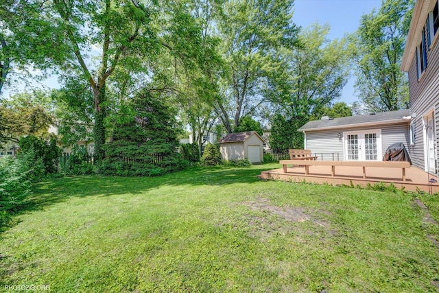 950 Belmar Ln, Buffalo Grove, IL 60089 - view of grassy yard with a shed, a wooden deck, and french doors