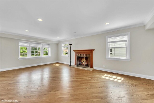 950 Belmar Ln, Buffalo Grove, IL 60089 - unfurnished living room featuring ornamental molding, light wood-type flooring, a brick fireplace, and recessed lighting