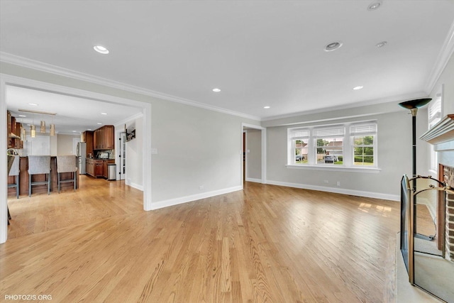 950 Belmar Ln, Buffalo Grove, IL 60089 - unfurnished living room with crown molding, light wood finished floors, recessed lighting, and a fireplace