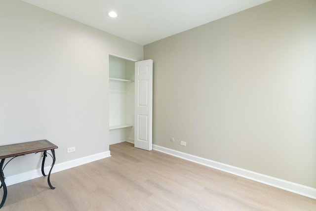 129 Highbury Dr, Elgin, IL 60120 - unfurnished bedroom with light wood-style flooring and recessed lighting