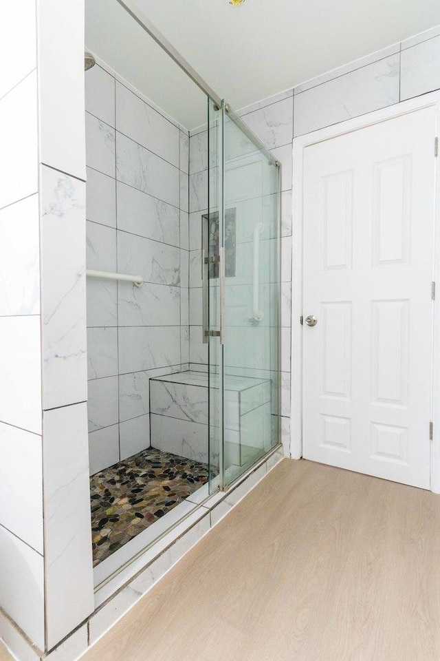 129 Highbury Dr, Elgin, IL 60120 - bathroom with a shower stall and wood finished floors