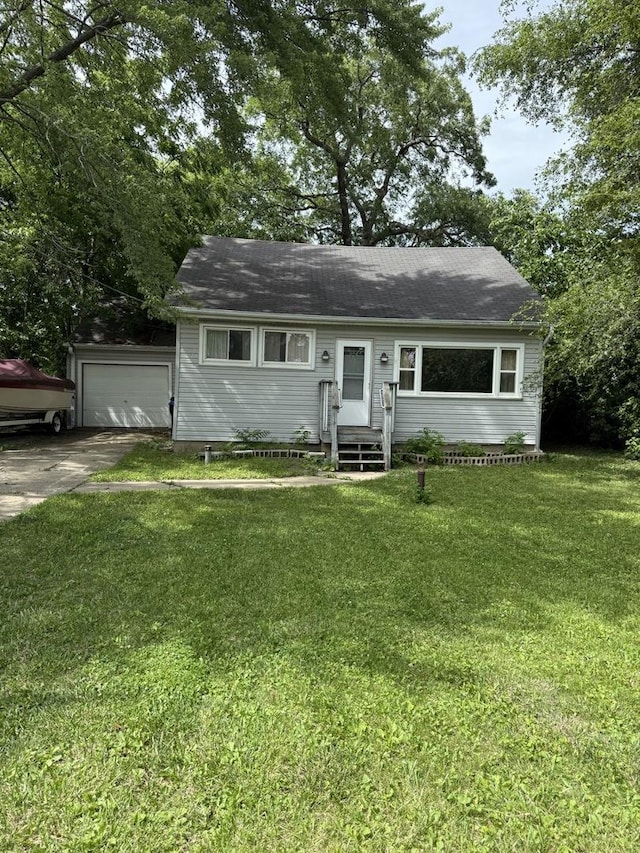 24576 W Norelius Ave, Round Lake, IL 60073 - view of front facade with concrete driveway, a front lawn, and an attached garage