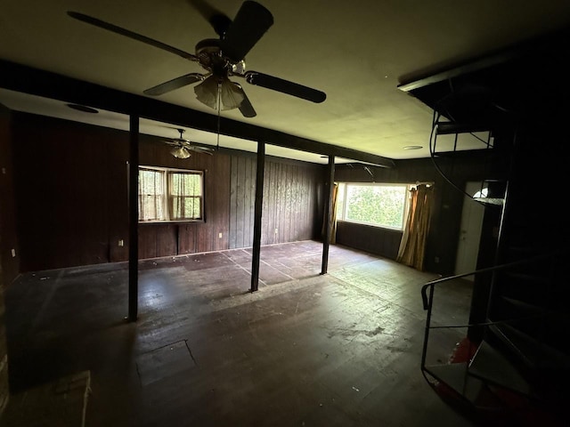 24576 W Norelius Ave, Round Lake, IL 60073 - basement with healthy amount of natural light, wood walls, and a ceiling fan