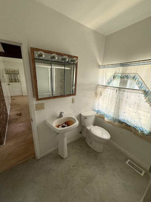 24576 W Norelius Ave, Round Lake, IL 60073 - bathroom featuring toilet and baseboards
