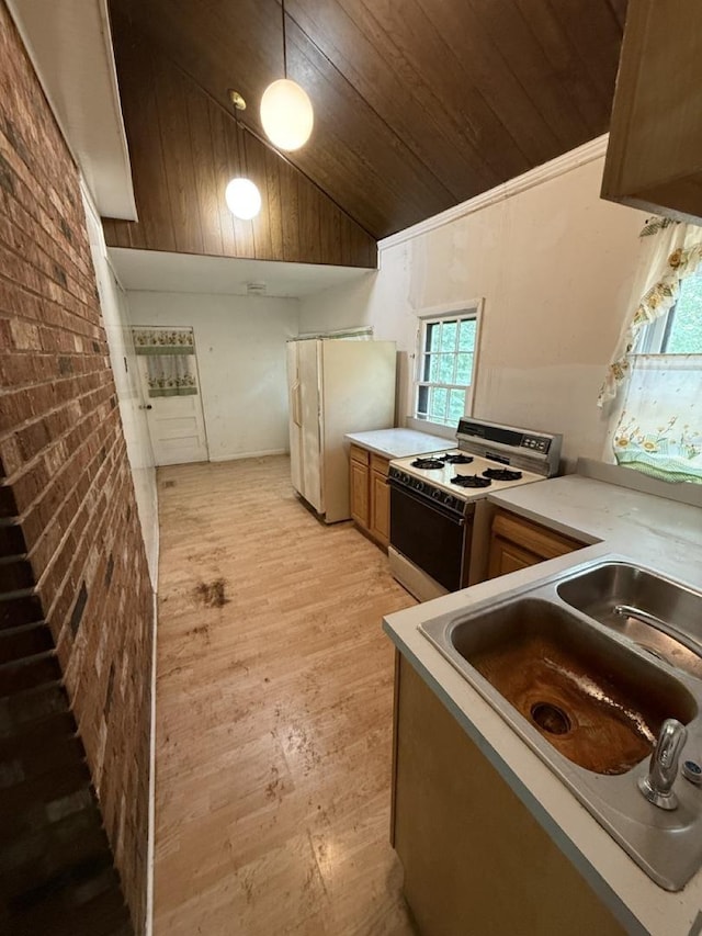 24576 W Norelius Ave, Round Lake, IL 60073 - kitchen with white range with gas stovetop, freestanding refrigerator, wooden ceiling, vaulted ceiling, and light wood finished floors
