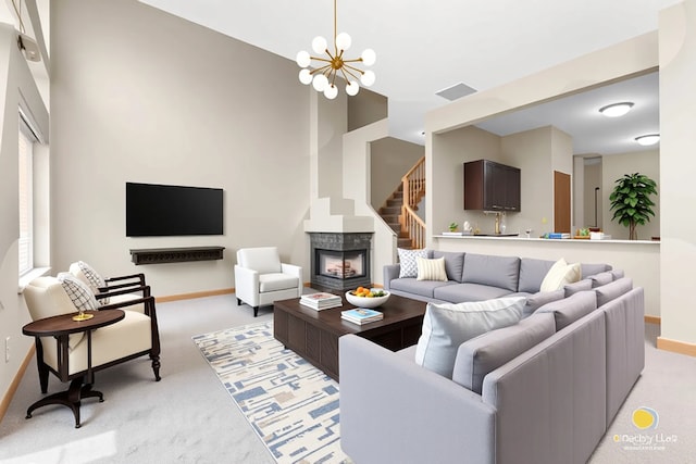 951 Viewpoint Dr, Lake In The Hills, IL 60156 - living room with light colored carpet, a chandelier, a fireplace, and stairway