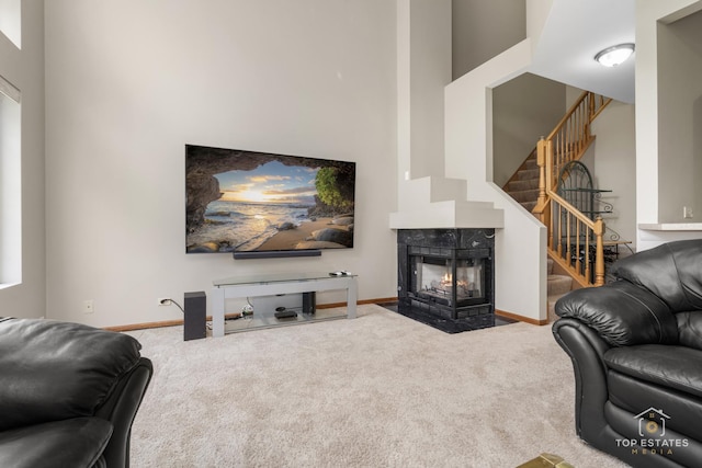 951 Viewpoint Dr, Lake In The Hills, IL 60156 - carpeted living area with stairway and a multi sided fireplace