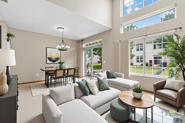 951 Viewpoint Dr, Lake In The Hills, IL 60156 - living area with plenty of natural light, a chandelier, carpet, and a high ceiling