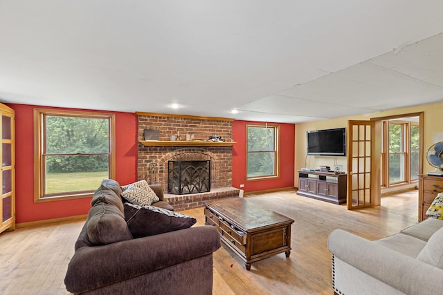 3457 W Hamilton Rd, Monee, IL 60449 - living area featuring hardwood / wood-style flooring, a fireplace, and healthy amount of natural light