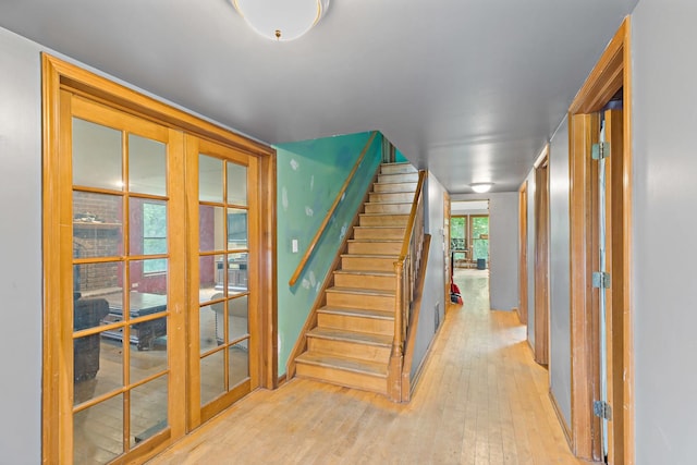 3457 W Hamilton Rd, Monee, IL 60449 - stairway with french doors and wood-type flooring