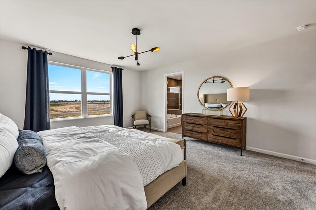 3194 Peyton Cir, Aurora, IL 60503 - carpeted bedroom featuring a chandelier and ensuite bath