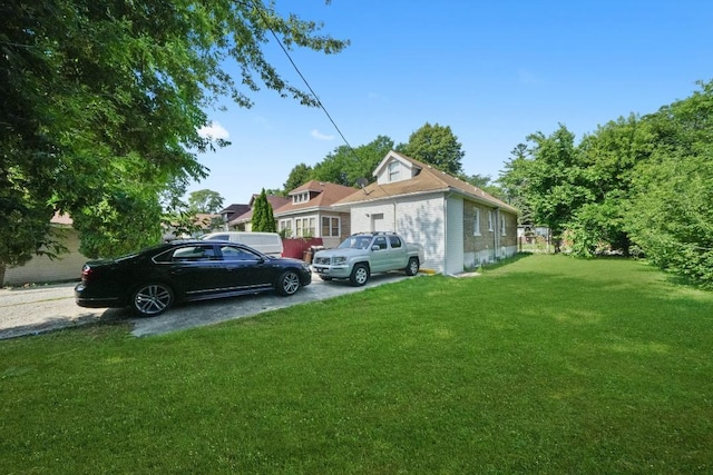 5217 S Green St, Chicago, IL 60609 - view of home's exterior featuring a lawn