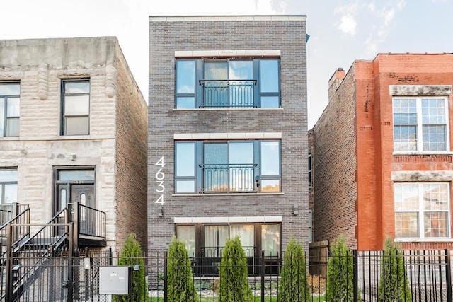 4634 S Langley Ave, Chicago, IL 60653 - view of front of home with brick siding and a fenced front yard