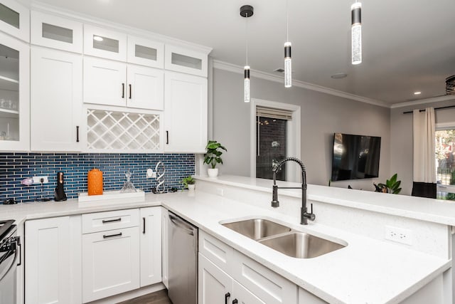 4634 S Langley Ave, Chicago, IL 60653 - kitchen with stainless steel appliances, crown molding, tasteful backsplash, a peninsula, and white cabinetry