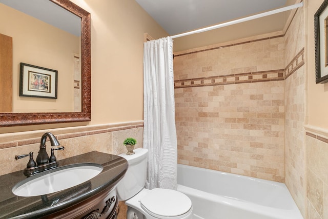 11016 Eaton Ct, Westchester, IL 60154 - full bathroom featuring tile walls, shower / bath combination with curtain, vanity, and a wainscoted wall