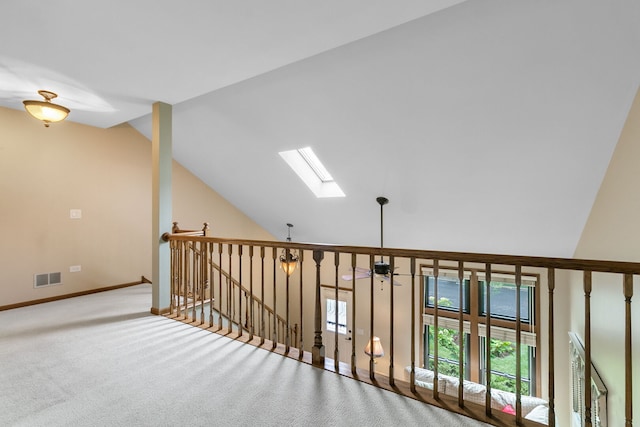 11016 Eaton Ct, Westchester, IL 60154 - corridor with a skylight, an upstairs landing, vaulted ceiling, and carpet floors