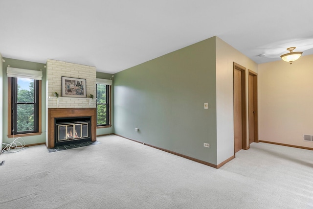 11016 Eaton Ct, Westchester, IL 60154 - unfurnished living room featuring carpet floors, healthy amount of natural light, and a brick fireplace