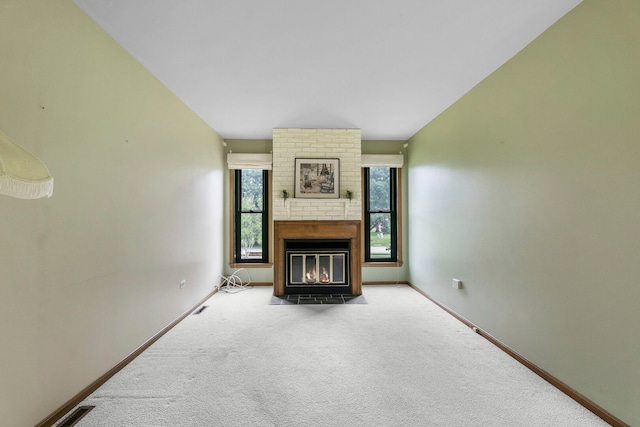 11016 Eaton Ct, Westchester, IL 60154 - unfurnished living room featuring carpet flooring and a fireplace