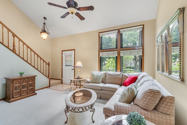 11016 Eaton Ct, Westchester, IL 60154 - living room featuring plenty of natural light, stairway, light colored carpet, ceiling fan, and high vaulted ceiling