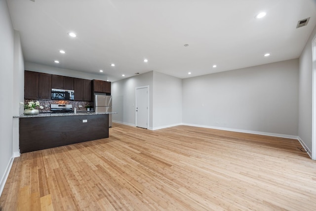 3130 W Walton St Unit 3, Chicago, IL 60622 - kitchen with appliances with stainless steel finishes, dark brown cabinets, decorative backsplash, recessed lighting, and light wood finished floors