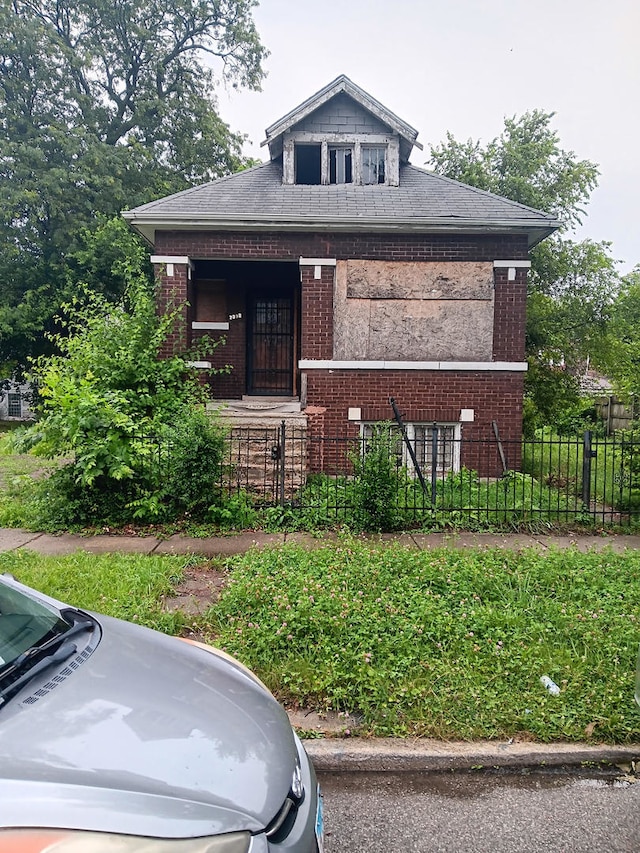 7339 S Peoria St, Chicago, IL 60621 - bungalow-style home with brick siding and a porch