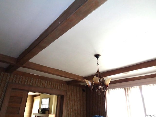 215 S 16th St, Quincy, IL 62301 - detailed view of beamed ceiling, a chandelier, and wallpapered walls