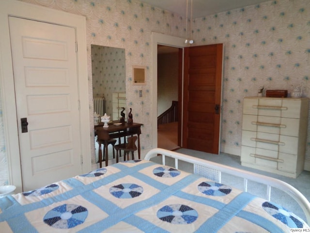 215 S 16th St, Quincy, IL 62301 - bedroom with wallpapered walls and radiator heating unit