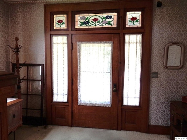 215 S 16th St, Quincy, IL 62301 - foyer featuring wallpapered walls and light colored carpet