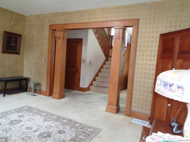 215 S 16th St, Quincy, IL 62301 - carpeted living area with stairs and baseboards