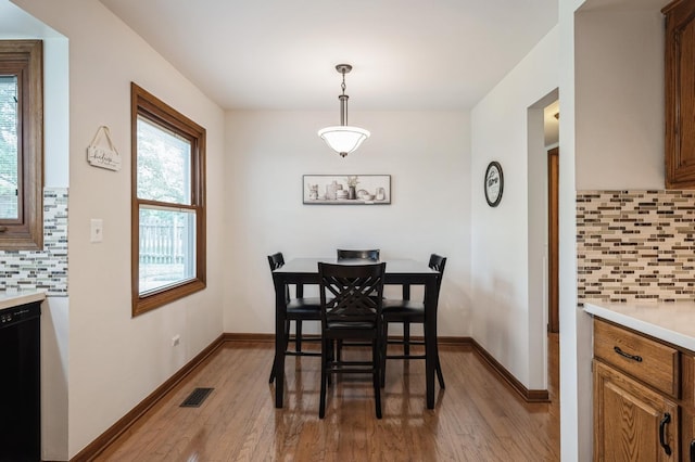 872 Asbury Ln, Schaumburg, IL 60193 - dining space with light wood-style floors and baseboards