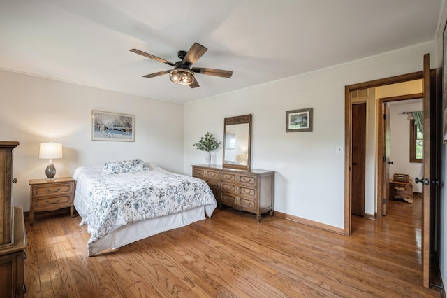 872 Asbury Ln, Schaumburg, IL 60193 - bedroom with light wood-style flooring, crown molding, and a ceiling fan